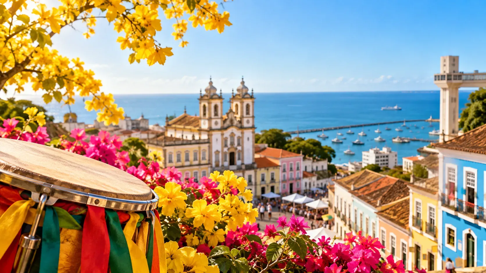 Vista ensolarada do Centro Histórico de Salvador com igreja, mar, casario colorido, flores amarelas e tambor com fitas em primeiro plano.